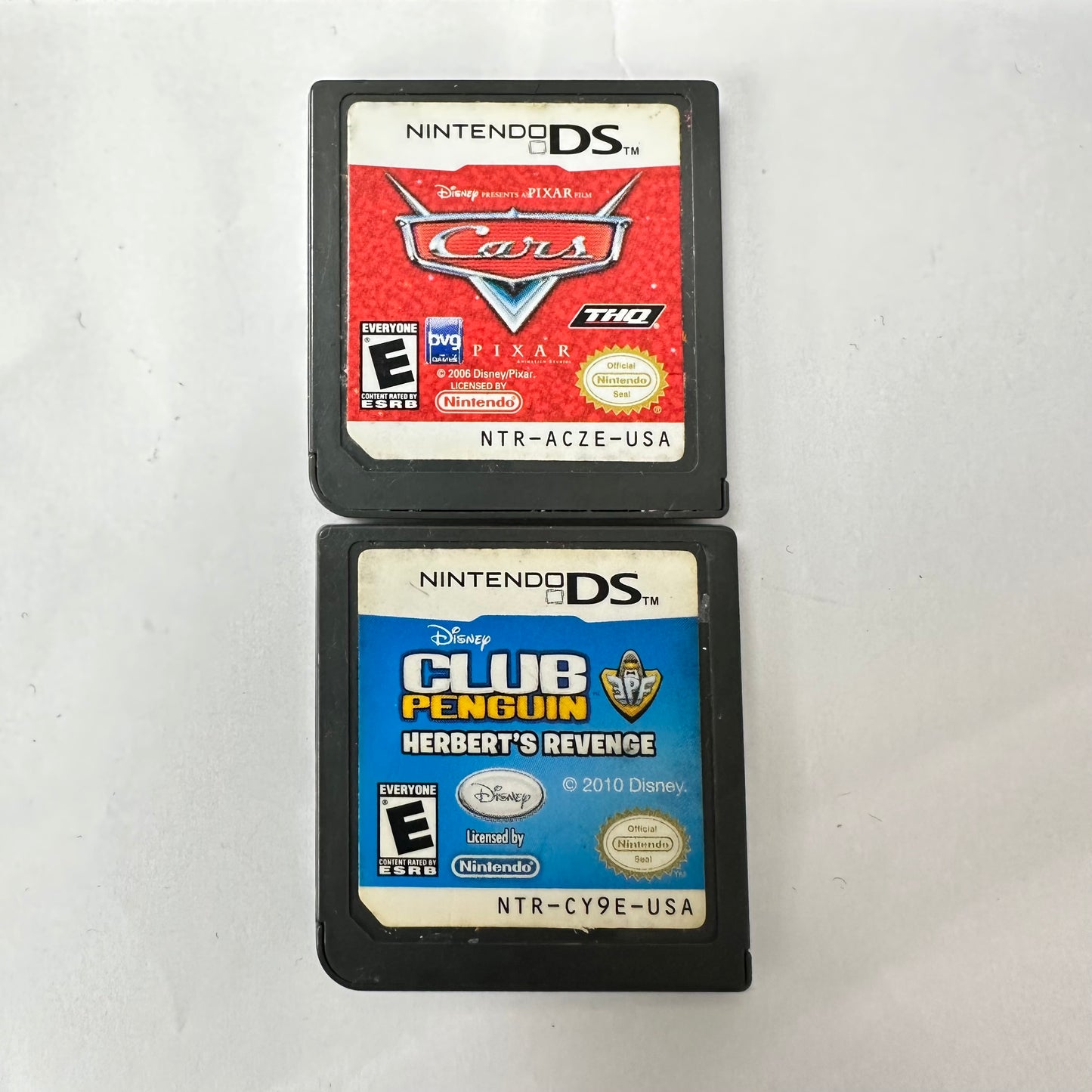 Lot of 2 Nintendo DS Games(Disney Pixar Cars|Disney Club Penguin Herbert's Revenge)
