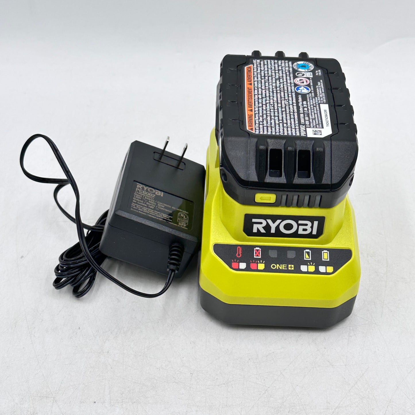 Ryobi One+ PC6002 120V Class 2 Battery Charger + PBP002 18V Li-Ion Battery